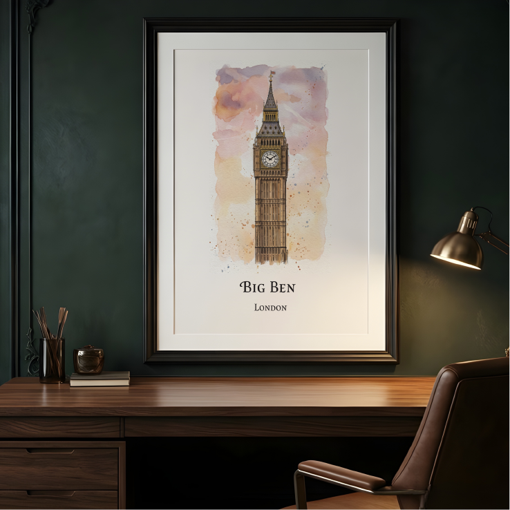 A framed watercolour art print of Big Ben, London, displayed on a dark green wall above a wooden desk with a lamp and chair.