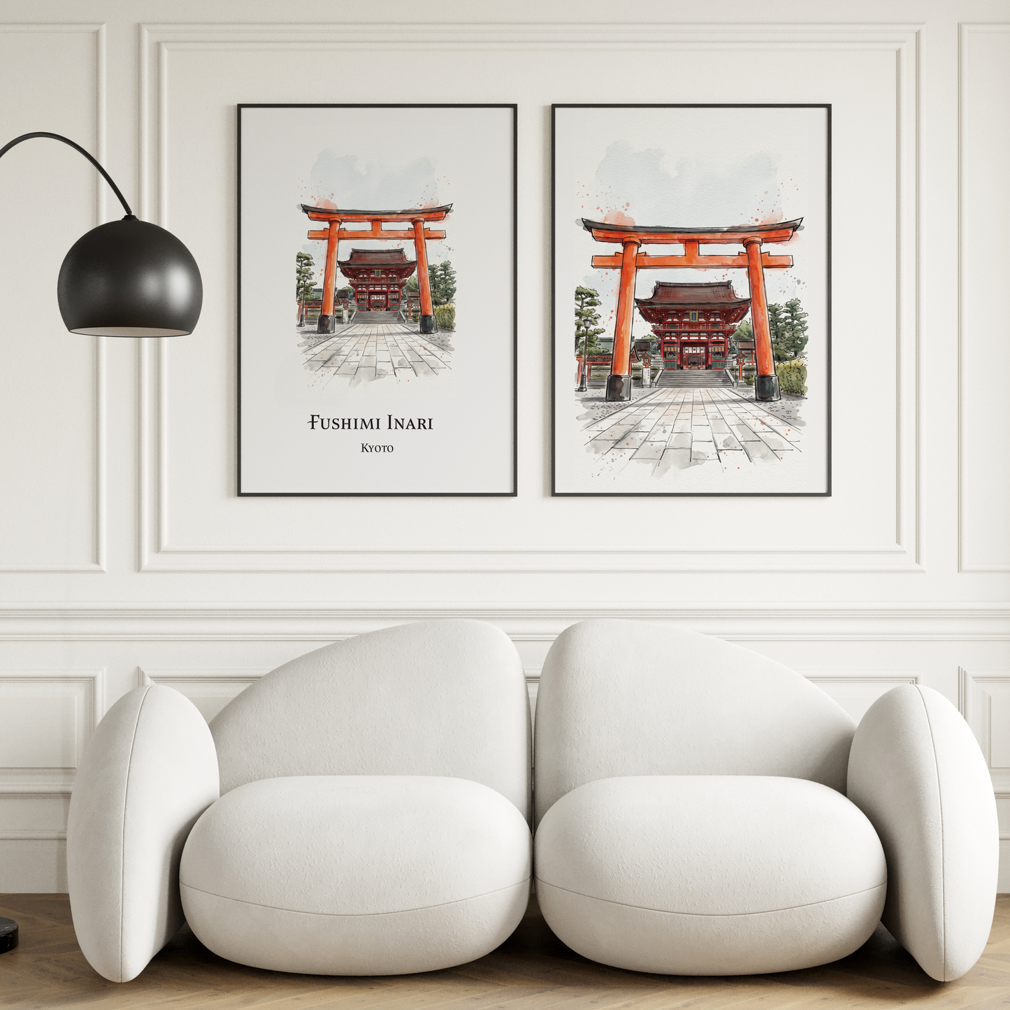 A modern white curved sofa in a bright living room, with two framed vertical art prints of Fushimi Inami Torii Gate in Kyoto hanging on the wall above. A black floor lamp stands to the left.