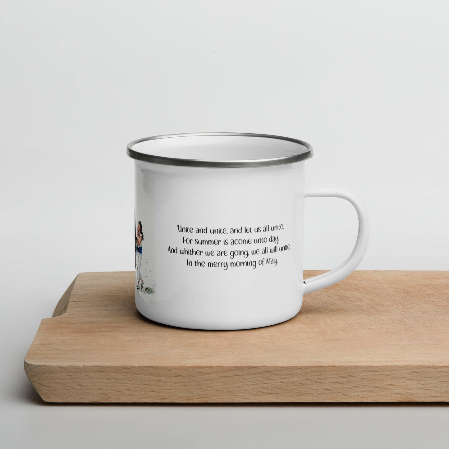 White enamel mug with Padstow Obby Oss song text and on a wooden chopping board