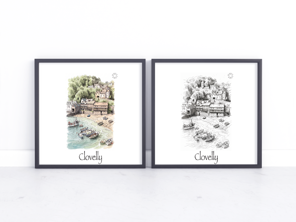 Two framed art prints leaning against a white wall on a light marble surface. The left print is a watercolour-style coastal scene with green trees and blue water, labeled 'Clovelly' at the bottom.