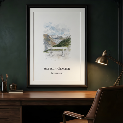 A framed art print of Aletsch Glacier, Switzerland, displayed on a dark green wall above a wooden desk with a leather chair and a lit desk lamp.