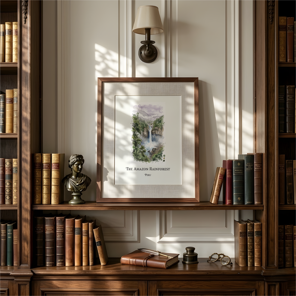 A framed watercolour art print titled 'The Amazon Rainforest' with a watercolor landscape illustration, displayed on a wooden bookshelf in a classic library setting.