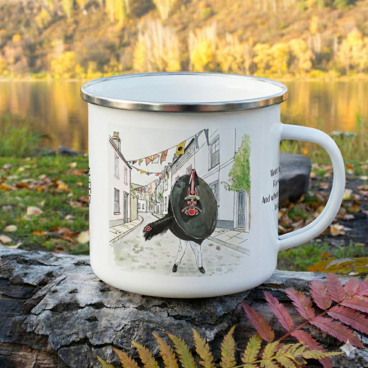 White enamel mug with a design of an Obby Oss in a street scene, placed outdoors with a natural background.