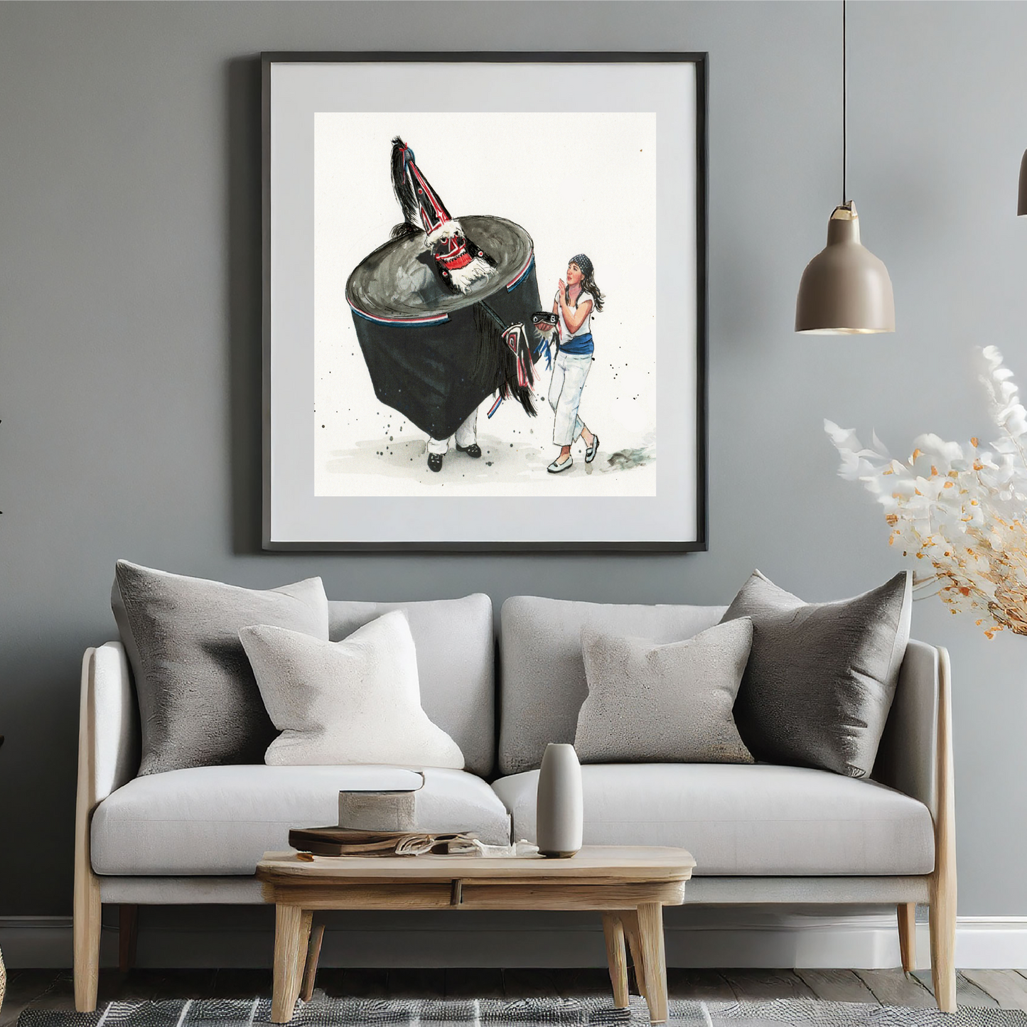 Padstow Blue Obby Oss watercolour travel poster in a black frame on a grey wall above a sofa