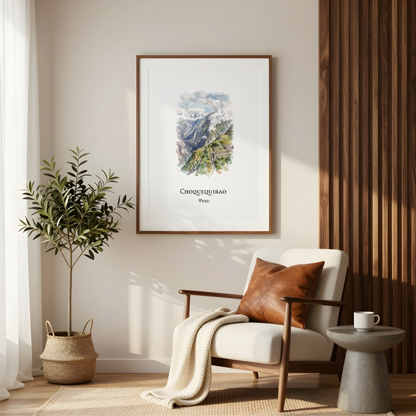 A framed art print of Choquequirao Peru, leaning against a window on a wooden ledge with neutral-toned curtains and dried grasses. The print features a watercolor illustration of the ancient ruins under a blue sky, with 'Choquequirao' and 'Peru' printed below.