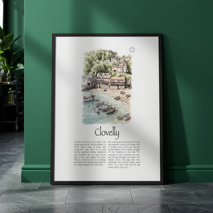 A framed art print titled 'Clovelly' leaning against a dark green wall on a dark tiled floor. The print features a detailed watercolour illustration of a coastal village with boats on the sea, above printed text.