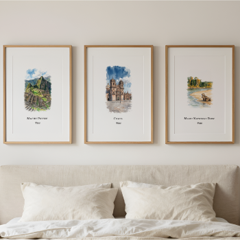 Three framed art prints depicting images of Cusco, hang above a neatly made bed in a minimalist bedroom setting.