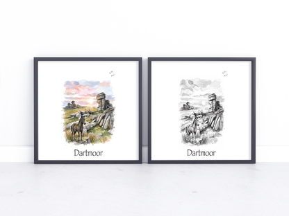 Two framed art prints labeled 'Dartmoor' displayed side by side on a white surface against a white wall. The left print is a colourful watercolour-style scene with a horse and rock formations under a pink sky, and the right print is a black-and-white sketch of the same scene.