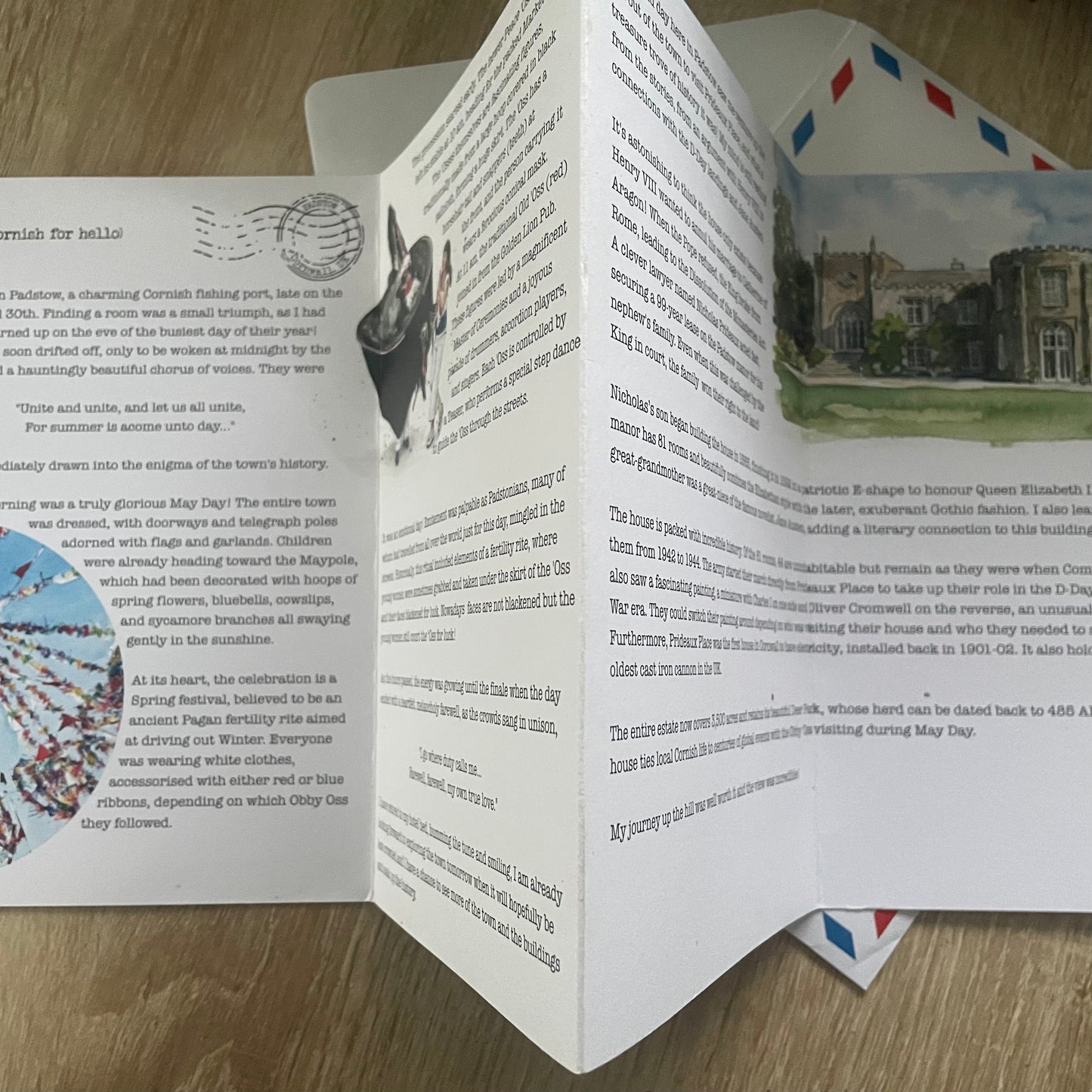 Reverse of a5 8 Page Letter home about Padstow with text, watercolour images, and illustrations on a white background with airmail envelope