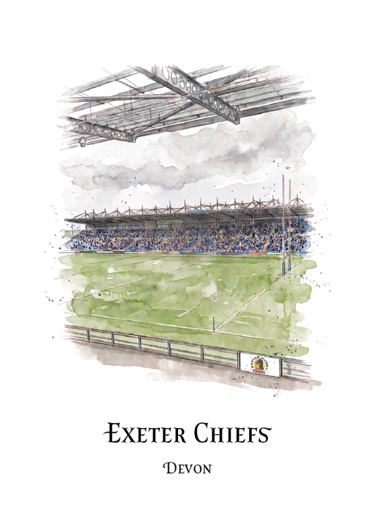 A watercolour-style sports poster print featuring a rugby stadium scene with a crowd, green field, and covered stands, with the text 'EXETER CHIEFS' and 'DEVON' below on a white background.