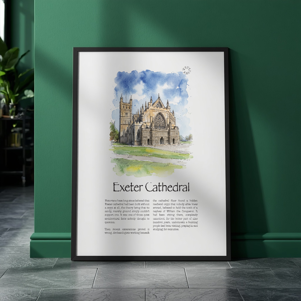 A framed art print featuring a watercolour illustration of Exeter Cathedral with text below, leaning against a dark green wall on a gray tiled floor.