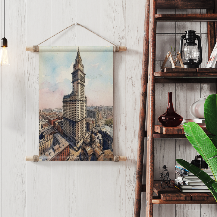 A vertical canvas wall hanging featuring a vintage cityscape of the New York F W Woolworth Building, styled on a white wood panelled wall next to a wooden ladder shelf with decorative items.