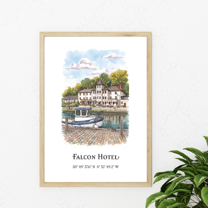 A framed art print featuring a watercolour illustration of the Falcon Hotel with boats and a river scene, displayed on a white wall next to a green plant.