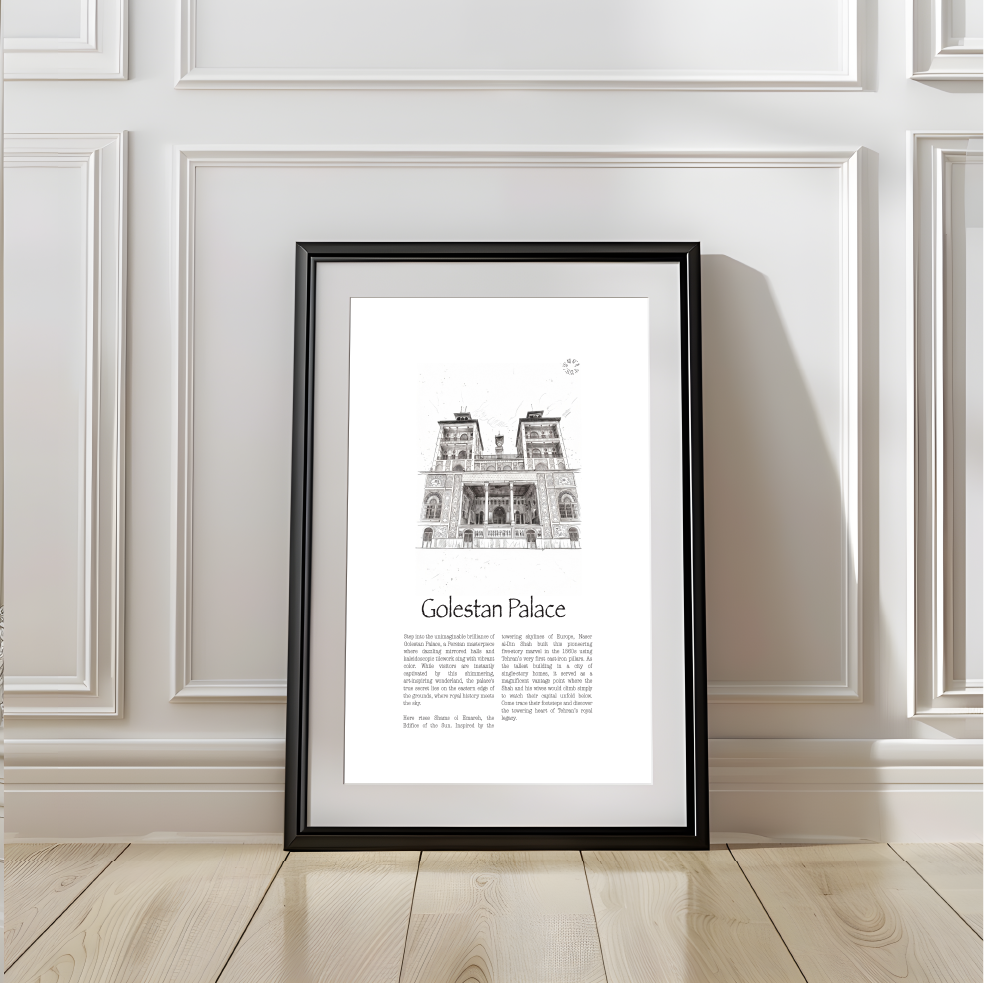 A framed black-and-white architectural art print of Golestan Palace leaning against a white paneled wall on a light wood floor.