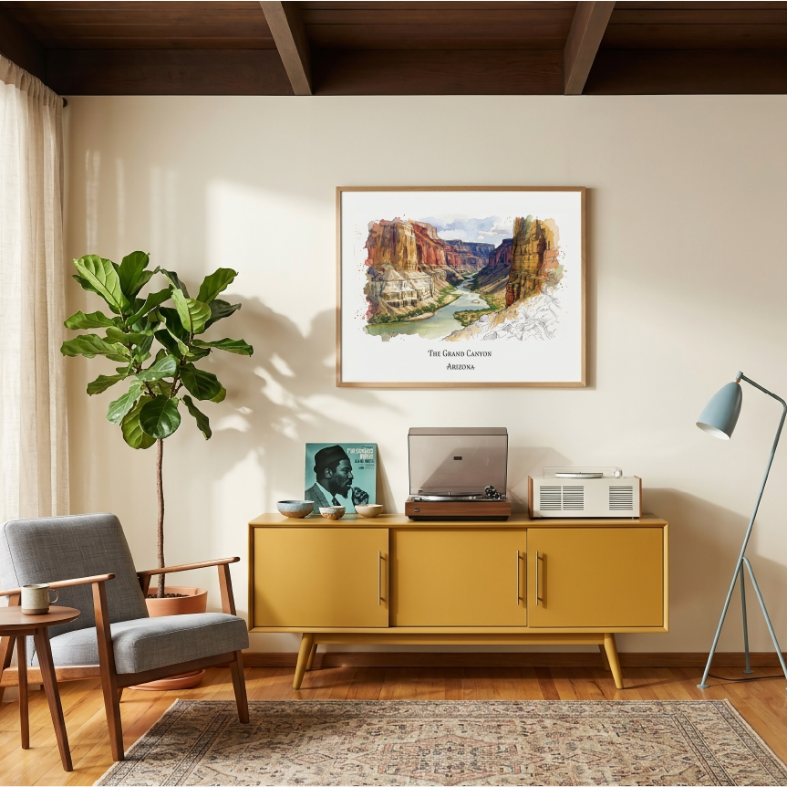 A framed art print depicting a scenic Grand Canyon landscape hangsing on a beige wall in a styled living room. The room features a mustard yellow mid-century modern sideboard with a record player and radio, a gray armchair, a potted fiddle-leaf fig, and a floor lamp.