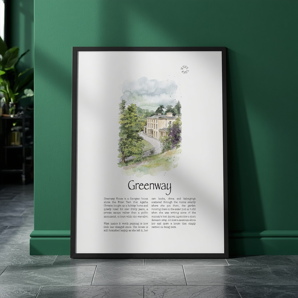 A framed vertical art print leaning against a dark green wall on a gray tiled floor. The print features a watercolour illustration of a historic green house in a wooded setting with the title 'Greenway' and descriptive text below.