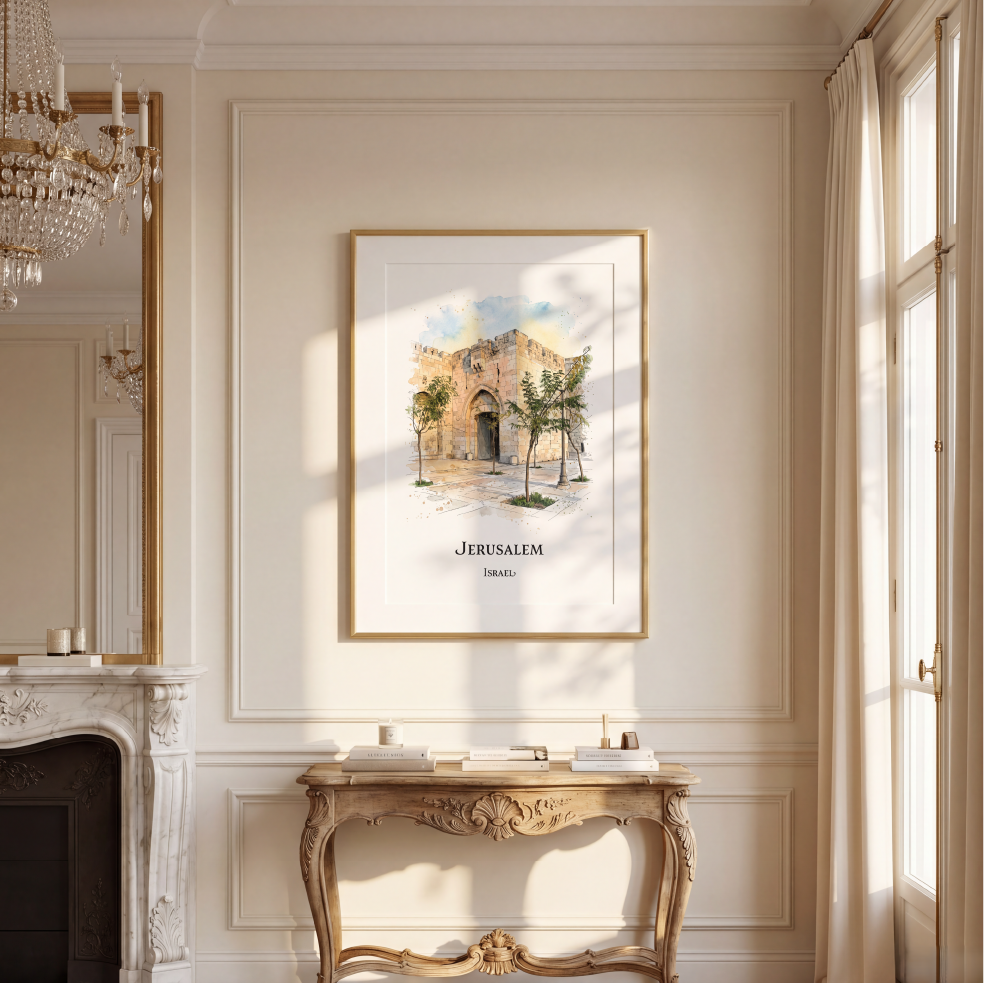 A framed art print depicting Jerusalem's old stone architecture and trees, hung on a cream-coloured wall above a decorative console table in a sunlit room.