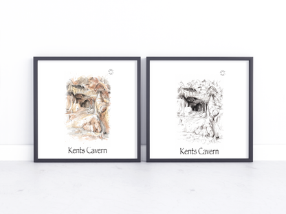 Two framed art prints leaning against a white wall on a light surface. The left print shows a coloured sketch of Kents Cavern with warm earthy tones, and the right print shows a black-and-white sketch of the same cave scene.