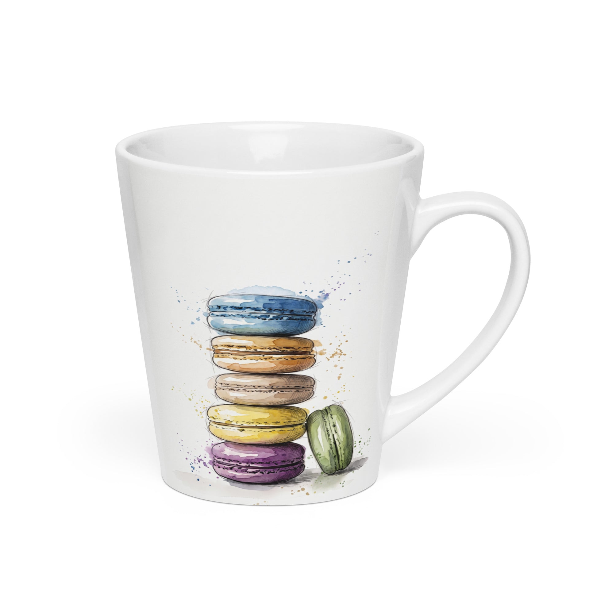 A white ceramic coffee mug featuring a watercolor illustration of a stack of colorful French macarons in blue, orange, brown, yellow, purple, and green, set against a plain white background and handle on the rght.