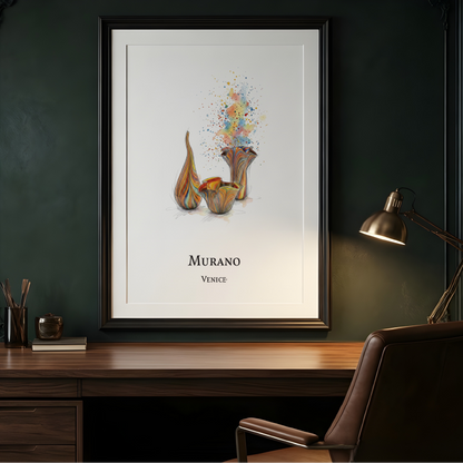 A framed art print featuring a watercolor-style illustration of ceramic vases and a flower with colorful paint splashes, labeled 'MURANO VENECE' at the bottom. The print is displayed on a dark green wall above a wooden desk with a chair and a lit desk lamp.
