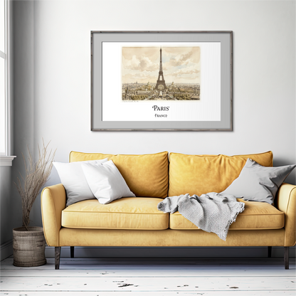 A framed art print of the Eiffel Tower in Paris, featuring a sepia-toned cityscape under a cloudy sky, displayed on a light gray wall above a mustard yellow sofa with decorative pillows.