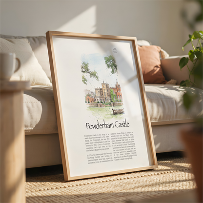 A framed art print featuring a watercolour illustration of Powderham Castle and its historical text, leaning against a beige sofa in a sunlit living room.