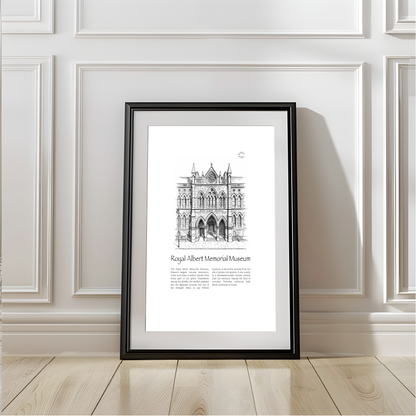A framed black-and-white architectural art print of the Royal Albert Memorial Museum in Exeter, leaning against a white paneled wall on a light wood floor.