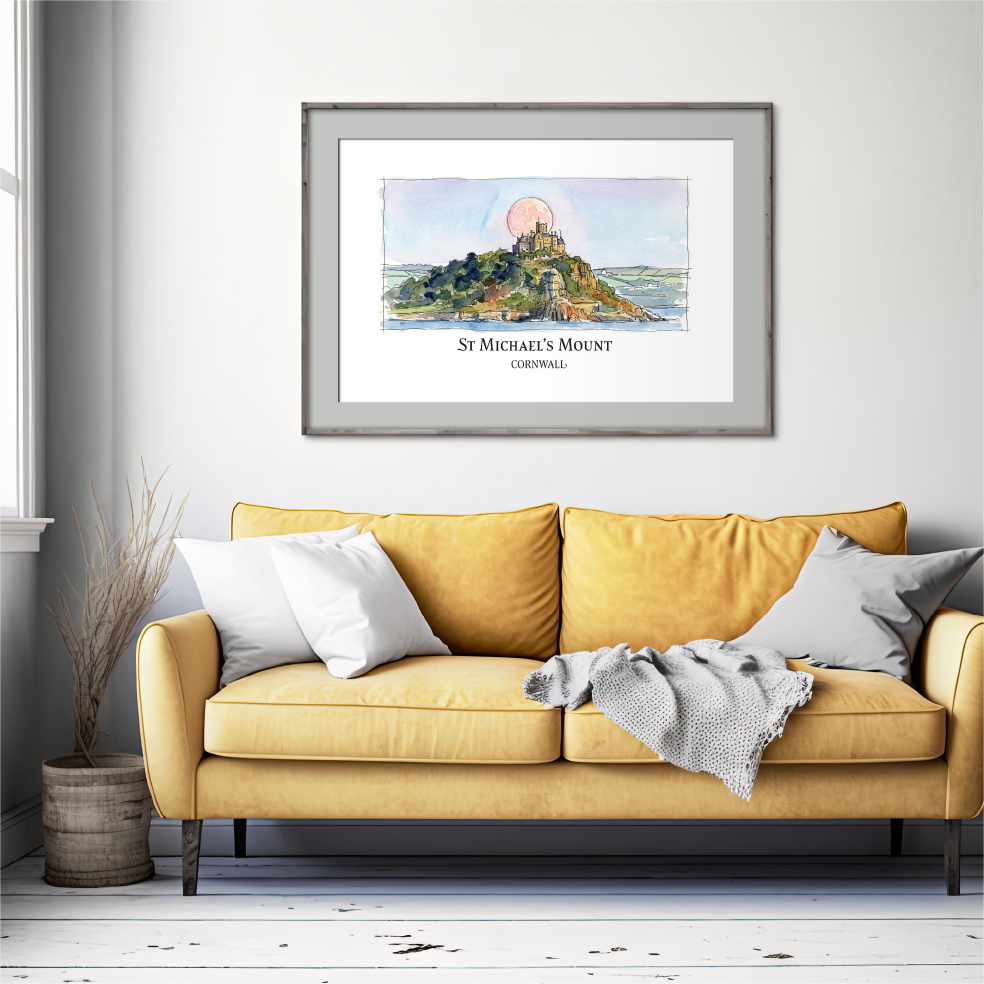 A framed art print of St Michael's Mount, Cornwall, displayed on a light gray wall above a yellow sofa in a modern living room setting.