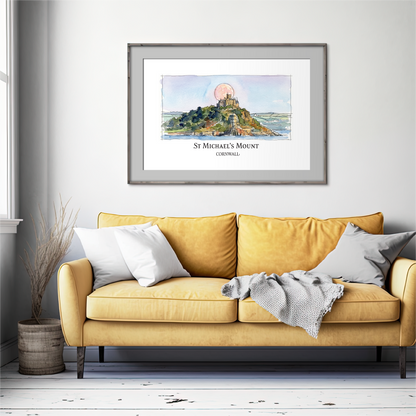 A framed art print of St Michael's Mount, Cornwall, displayed on a light gray wall above a yellow sofa in a modern living room setting.