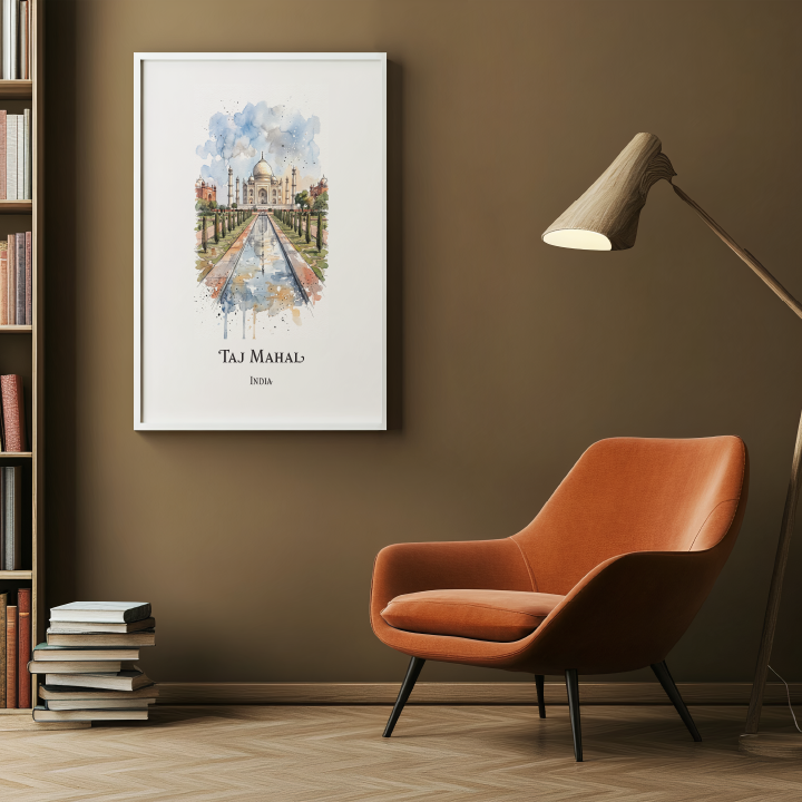 A framed watercolour art print of Taj Mahal hanging on a brown wall in a modern living room setting with an orange armchair, a floor lamp, and a bookshelf.
