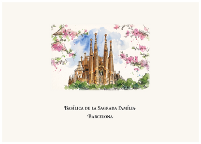 A watercolour-style travel print featuring the Sagrada Familia in Barcelona, with pink blossoms framing the illustration and the text 'Basílica de la Sagrada Família' and 'Barcelona' below on an off-white background.