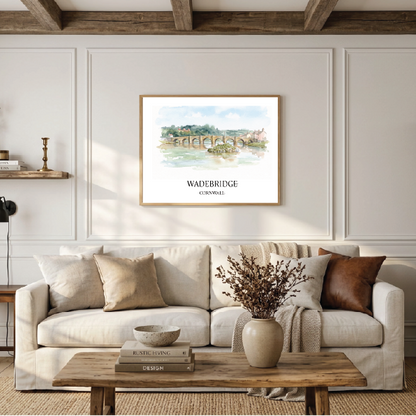 Wadebridge Bridge watercolour travel art poster displayed in a frame on a wall