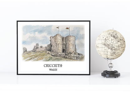 Framed artwork of Criccieth Castle in Wales with a globe on a white background